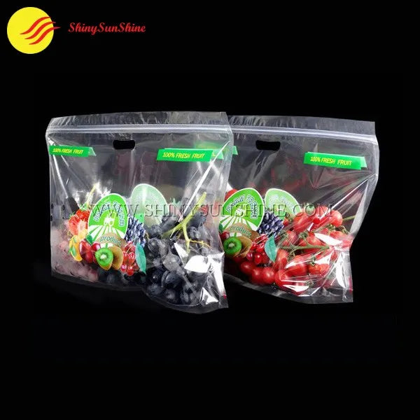 Clear plastic fruit packaging bag showcasing apples with custom logo and moisture vents