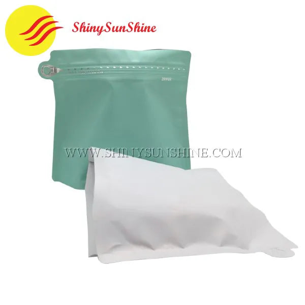 Assorted matte foil coffee bags in various sizes with personalized prints and flat bottom