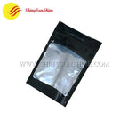 Black stand-up pouch with clear window on a white background
