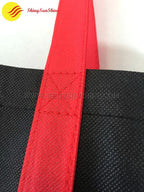 Custom foldable non-woven tote shopping bag with snap closure and reinforced handles