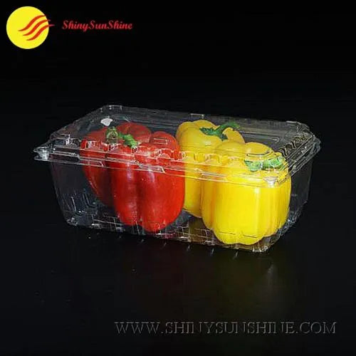 Clear plastic container with red and yellow bell peppers