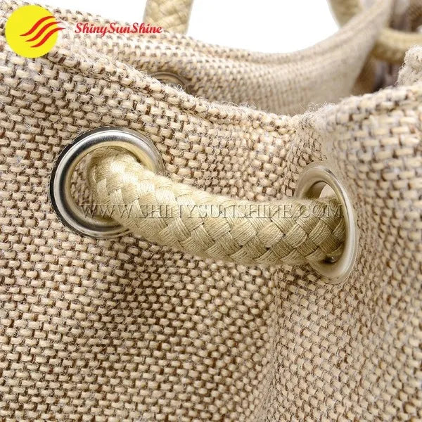 Close-up of jute tote bag showing textured natural fiber and reinforced stitching
