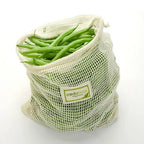 Minimalist vegetable mesh pouch with subtle custom logo and natural texture finish