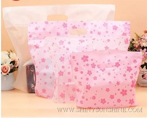 Assorted plastic shopping bags with handles in various sizes and personalized branding