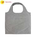 Foldable polyester tote shopping bag with custom print and reinforced handles
