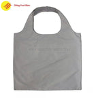 Foldable polyester tote shopping bag with custom print and reinforced handles
