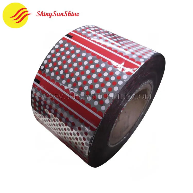 Custom-printed plastic roll film on industrial dispenser ready for packaging use