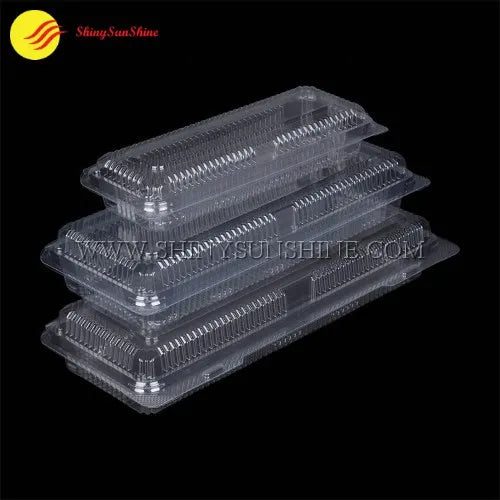 Group of empty clamshell boxes arranged for bulk packaging or distribution