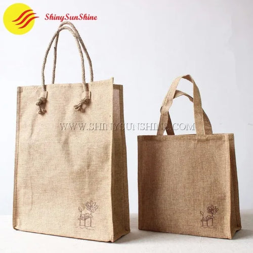 Multiple eco-friendly jute tote bags with custom logos displayed together