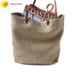 Custom jute tote handbag with durable leather handles and natural texture