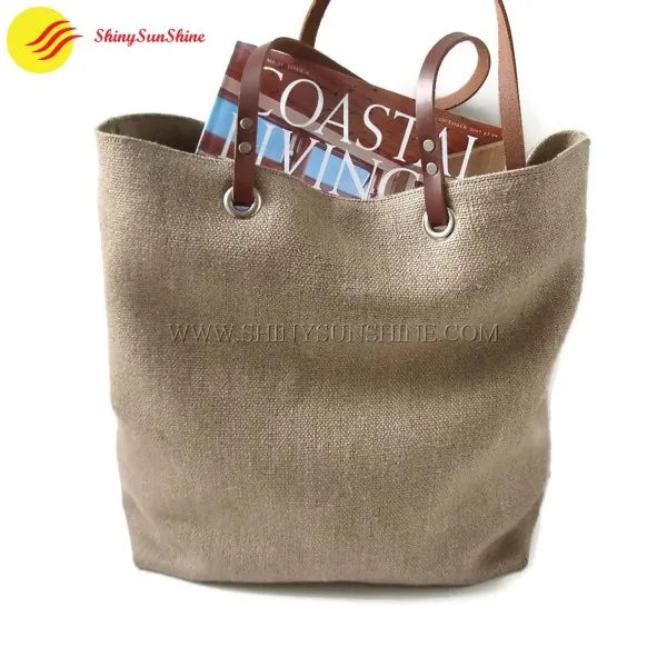 Custom jute tote handbag with durable leather handles and natural texture