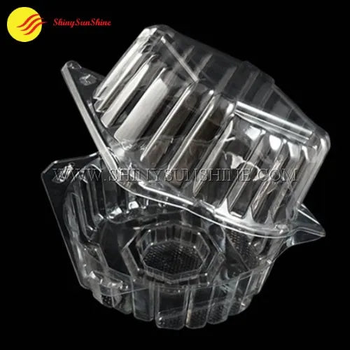 Empty clear clamshell packaging box for fresh lettuce with hinged lid and vented design