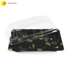 Empty plastic sushi tray featuring glossy finish and branding area