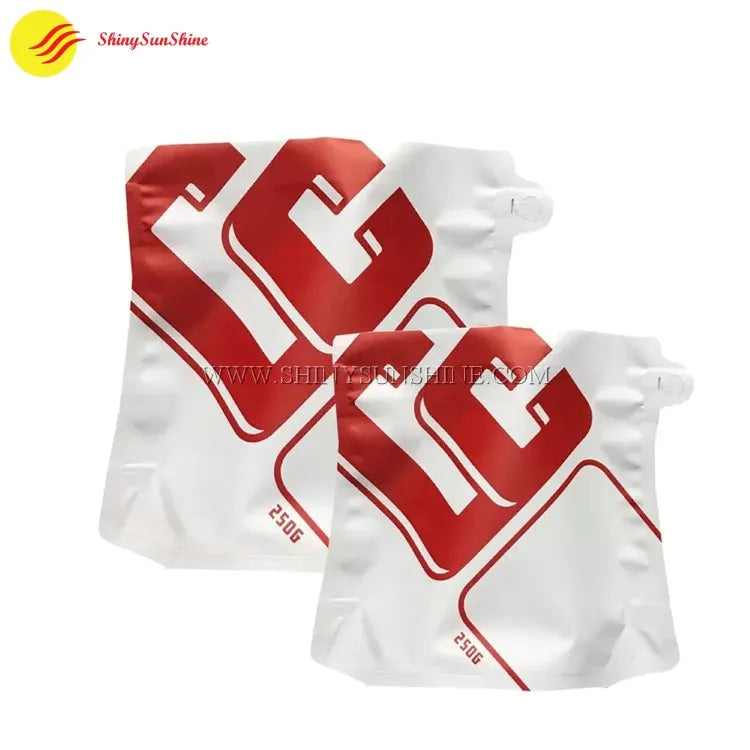 Custom-shaped coffee pouch photographed upright with vibrant graphics and foil lining
