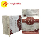 Custom Mylar Kraft pouch photographed upright with natural texture and bold branding
