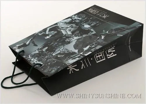 Black and gray patterned box with visible branding on a white background
