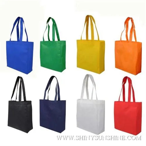 Assorted PP non-woven bags with and without logos in various colors and sizes