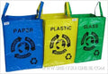 Three recycling bags labeled 'Paper', 'Plastic', and 'Glass' with recycling symbols on a white background.